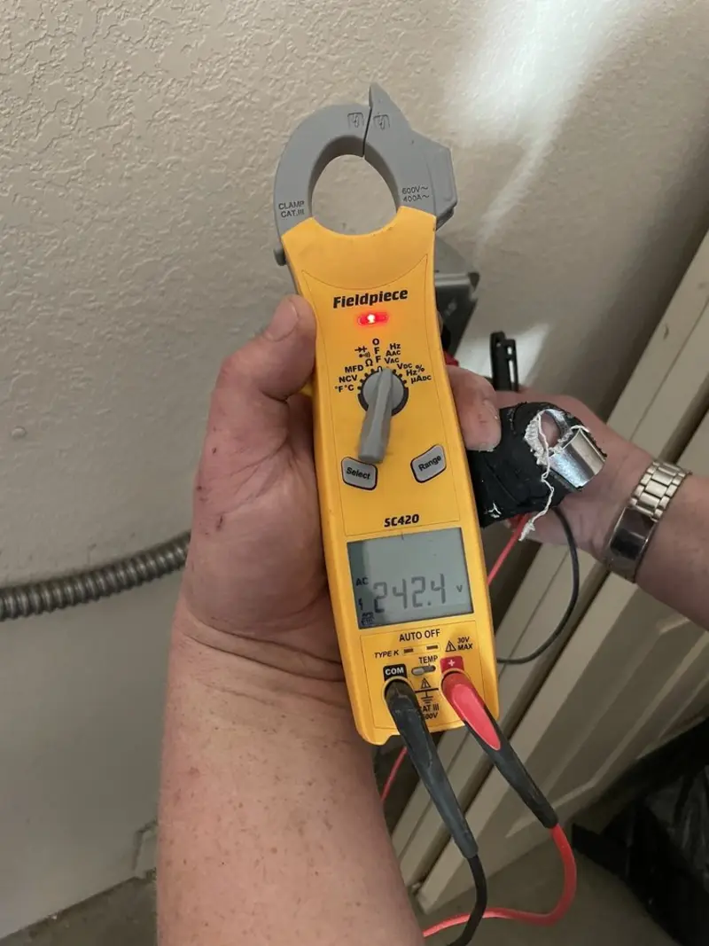Voltage testing with clamp meter during Ceiling Fan Installation in Burley